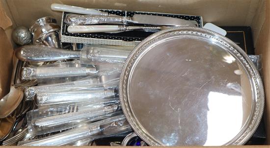 Silver-handled flatware, including a set of six dinner knives, a silver-backed hand mirror and sundry plate,